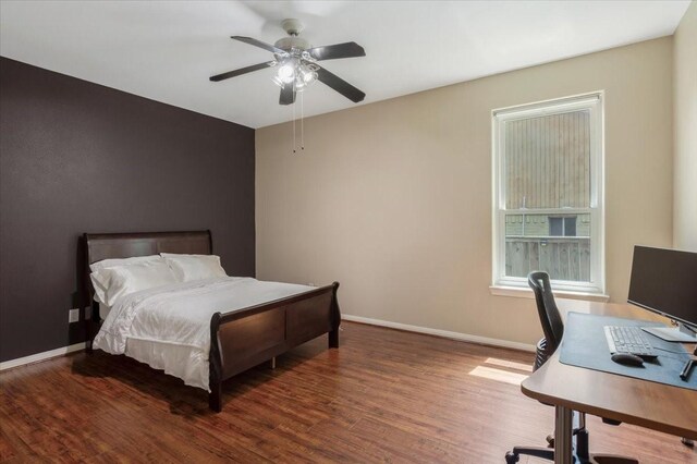5343 Oak Cove Dr, Houston, TX 77091 - bedroom featuring wood finished floors, an office area, and a ceiling fan