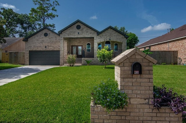 5343 Oak Cove Dr, Houston, TX 77091 - french country style house with driveway, a garage, french doors, and brick siding