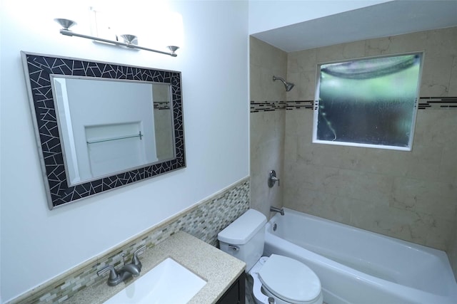 2101 Fountain View Dr Unit 55, Houston, TX 77057 - full bathroom featuring tile walls,  shower combination, vanity, and a wainscoted wall