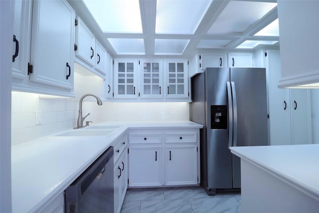 2101 Fountain View Dr Unit 55, Houston, TX 77057 - kitchen featuring appliances with stainless steel finishes, tasteful backsplash, white cabinetry, and light countertops
