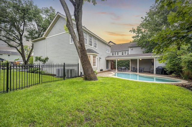 2120 Gostick St, Houston, TX 77008 - back of property at dusk with a patio