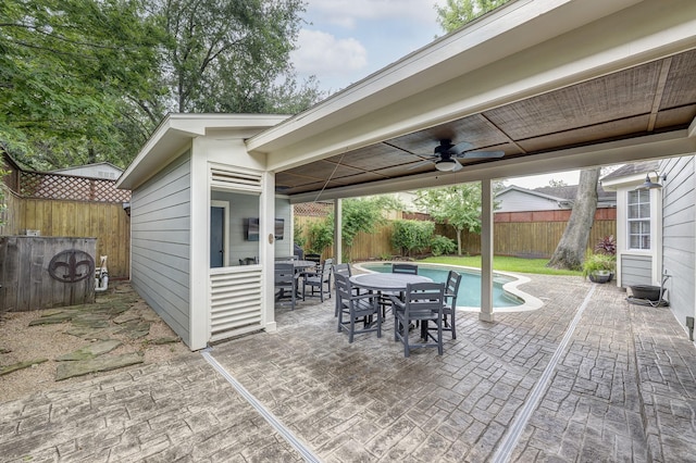 2120 Gostick St, Houston, TX 77008 - fenced backyard with ceiling fan, a patio area, and outdoor dining area