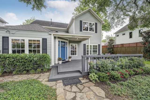 2120 Gostick St, Houston, TX 77008 - view of front facade with a shingled roof and a wooden deck