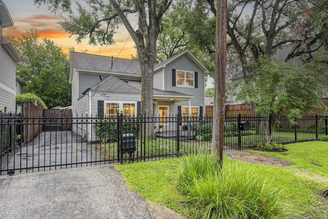 2120 Gostick St, Houston, TX 77008 - view of front facade with a shingled roof, a fenced front yard, and a gate