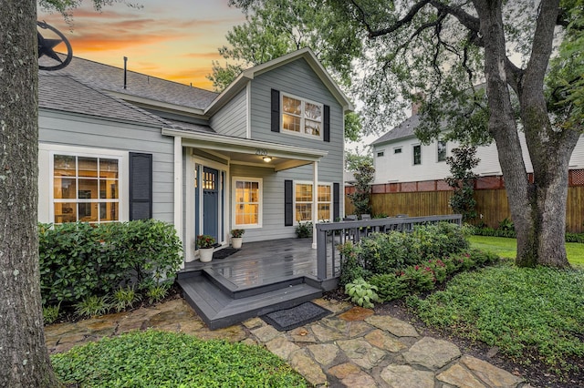 2120 Gostick St, Houston, TX 77008 - view of front of house with a deck and a shingled roof
