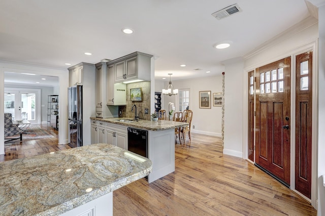 2120 Gostick St, Houston, TX 77008 - kitchen with freestanding refrigerator, ornamental molding, light wood-style floors, gray cabinetry, and dishwasher