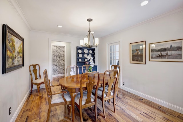 2120 Gostick St, Houston, TX 77008 - dining room featuring a chandelier, light wood finished floors, crown molding, and recessed lighting