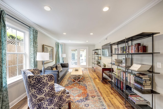 2120 Gostick St, Houston, TX 77008 - living room featuring ornamental molding, wood finished floors, french doors, and recessed lighting