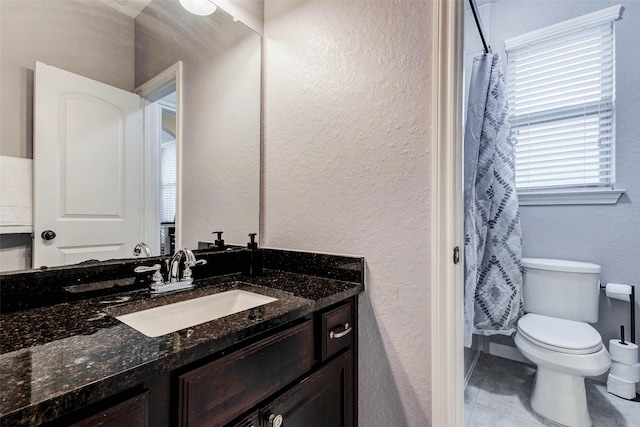 2302 Lakecrest Gardens Dr, Katy, TX 77493 - bathroom with vanity, a textured wall, tile patterned floors, and a shower with curtain
