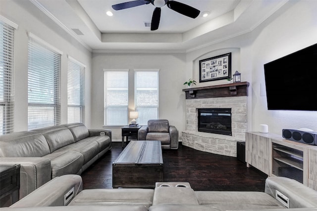 2302 Lakecrest Gardens Dr, Katy, TX 77493 - living area featuring a ceiling fan, a fireplace, a raised ceiling, wood finished floors, and recessed lighting