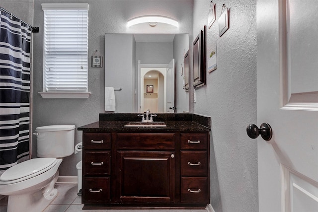2302 Lakecrest Gardens Dr, Katy, TX 77493 - full bath with vanity, a textured wall, tile patterned flooring, and a shower with shower curtain