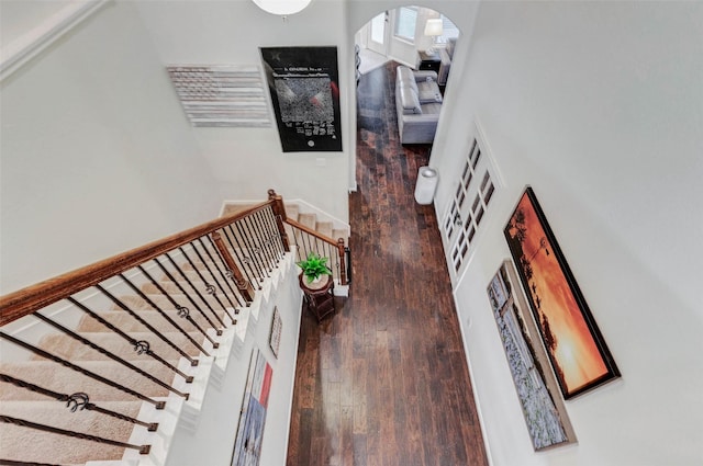 2302 Lakecrest Gardens Dr, Katy, TX 77493 - stairway featuring arched walkways and hardwood / wood-style floors