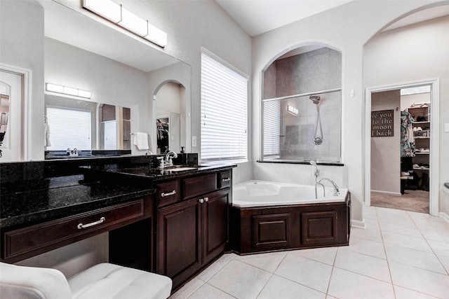 2302 Lakecrest Gardens Dr, Katy, TX 77493 - bathroom featuring a spacious closet, a garden tub, tile patterned floors, and vanity
