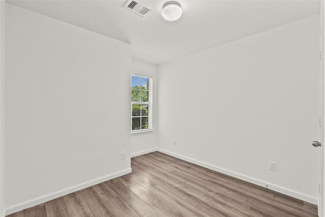 11007 View Pointe Ln, Houston, TX 77034 - spare room with wood finished floors and a textured ceiling