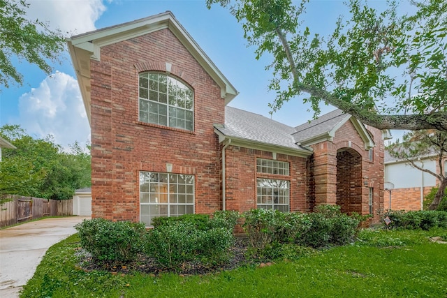 1615 Monvale Ln, Sugar Land, TX 77479 - view of front facade with brick siding, roof with shingles, concrete driveway, and a garage
