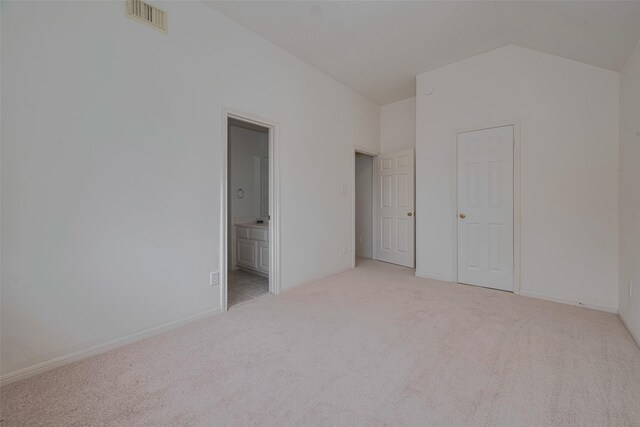 1615 Monvale Ln, Sugar Land, TX 77479 - unfurnished bedroom with carpet flooring, vaulted ceiling, and connected bathroom
