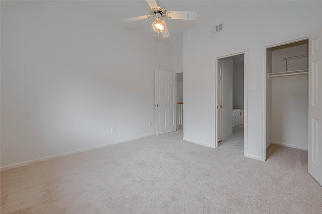 1615 Monvale Ln, Sugar Land, TX 77479 - unfurnished bedroom with light colored carpet, a towering ceiling, a closet, and a ceiling fan