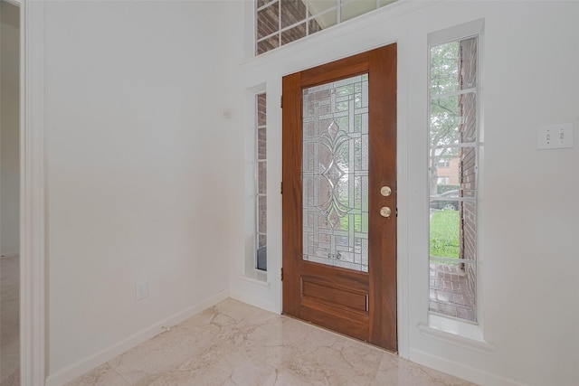 1615 Monvale Ln, Sugar Land, TX 77479 - entrance foyer featuring healthy amount of natural light and marble finish floors