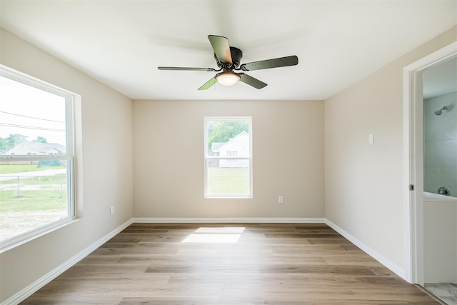 3108 Memel St, Houston, TX 77026 - spare room featuring light wood-type flooring and ceiling fan