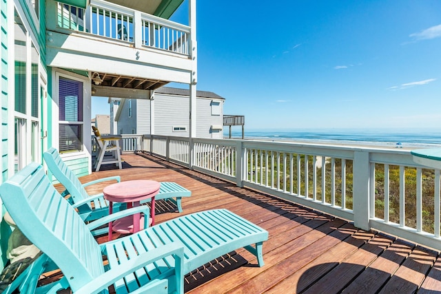 22831 Gulf Dr, Galveston, TX 77554 - wooden terrace with a water view