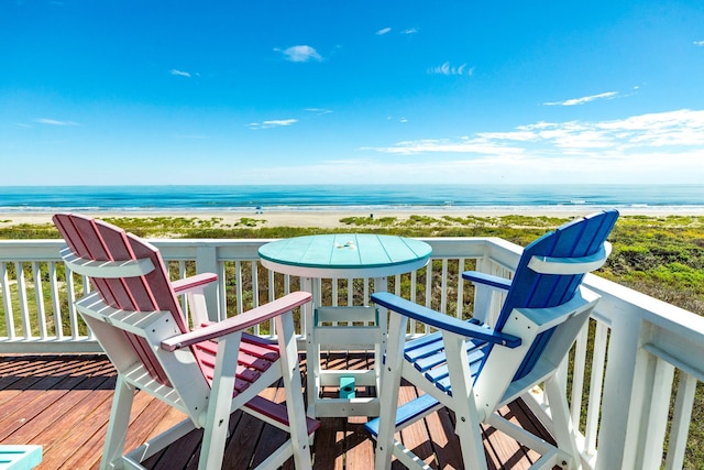 22831 Gulf Dr, Galveston, TX 77554 - wooden terrace featuring view of water and beach