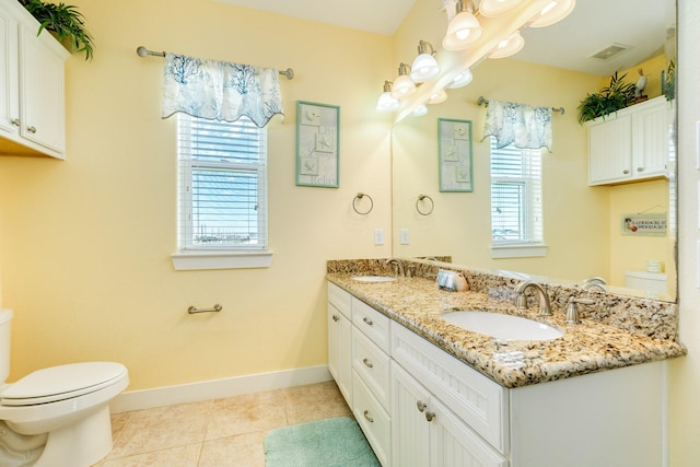 22831 Gulf Dr, Galveston, TX 77554 - bathroom featuring double vanity and tile patterned flooring