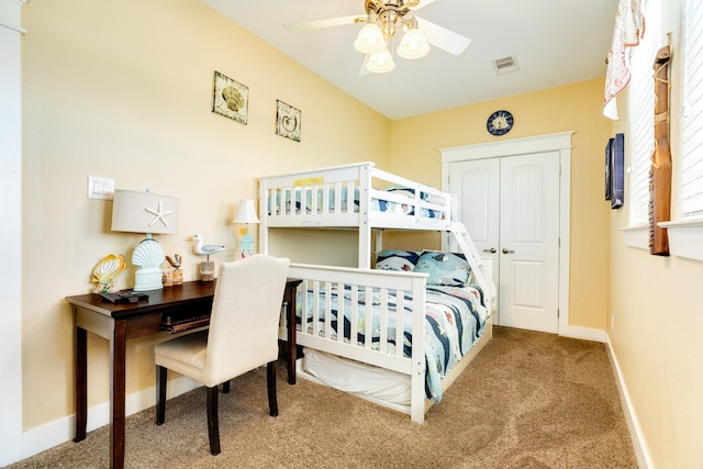 22831 Gulf Dr, Galveston, TX 77554 - carpeted bedroom featuring an office area, a closet, and a ceiling fan