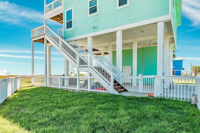 22831 Gulf Dr, Galveston, TX 77554 - rear view of house featuring a fenced backyard and stairs