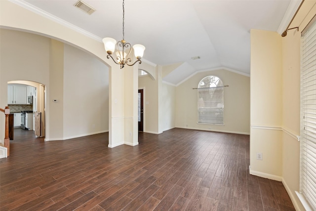 9135 Eaglecove Dr, Houston, TX 77064 - unfurnished living room featuring arched walkways, a chandelier, dark wood-type flooring, and lofted ceiling