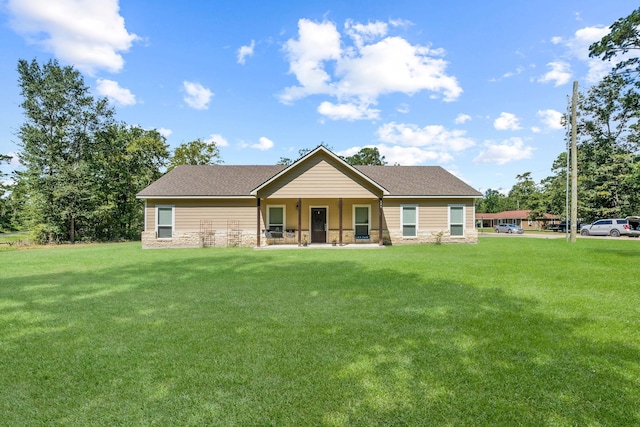 468 Brahman, Onalaska, TX 77360 - view of front facade featuring stone siding, a front yard, and roof with shingles