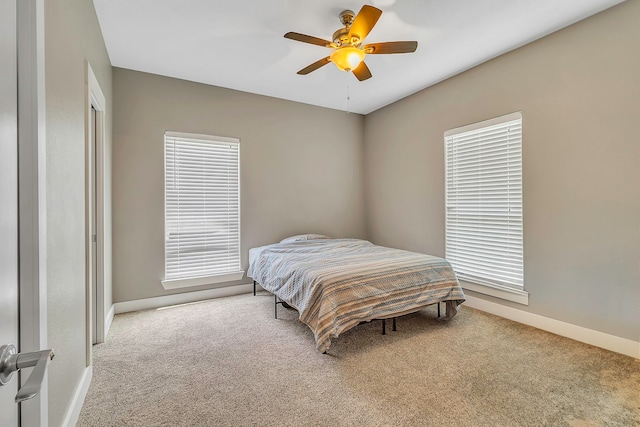 468 Brahman, Onalaska, TX 77360 - carpeted bedroom with baseboards and a ceiling fan