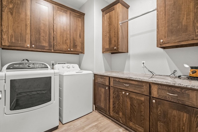 468 Brahman, Onalaska, TX 77360 - washroom with cabinet space, light wood-type flooring, and washer and clothes dryer