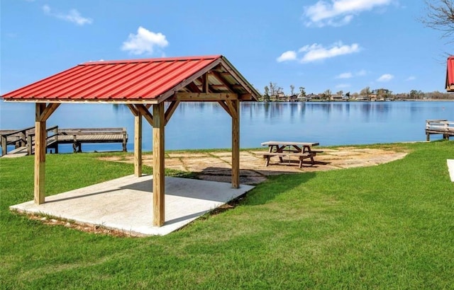 468 Brahman, Onalaska, TX 77360 - view of home's community with a yard, a patio, and a water view
