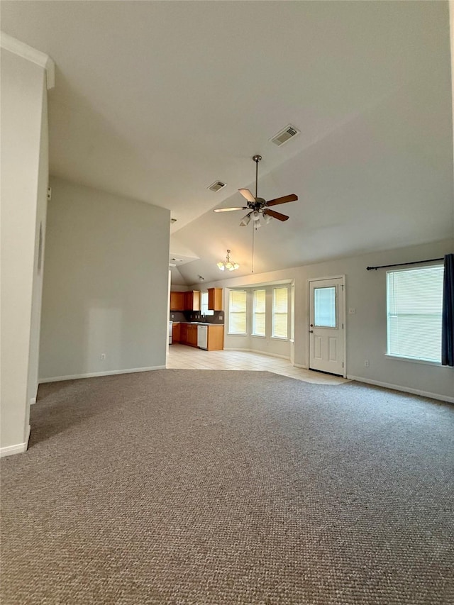 1140 Thomas Dr, Angleton, TX 77515 - unfurnished living room featuring light colored carpet, lofted ceiling, and ceiling fan