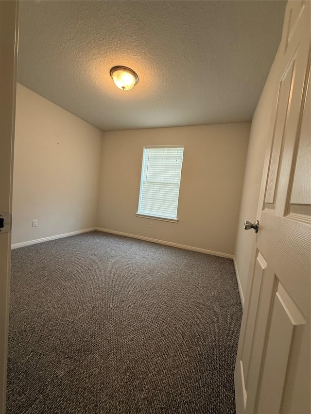 1140 Thomas Dr, Angleton, TX 77515 - unfurnished room featuring carpet floors and a textured ceiling