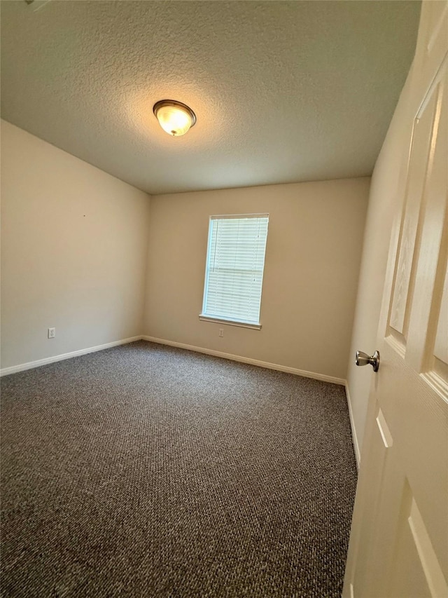 1140 Thomas Dr, Angleton, TX 77515 - carpeted spare room with baseboards and a textured ceiling