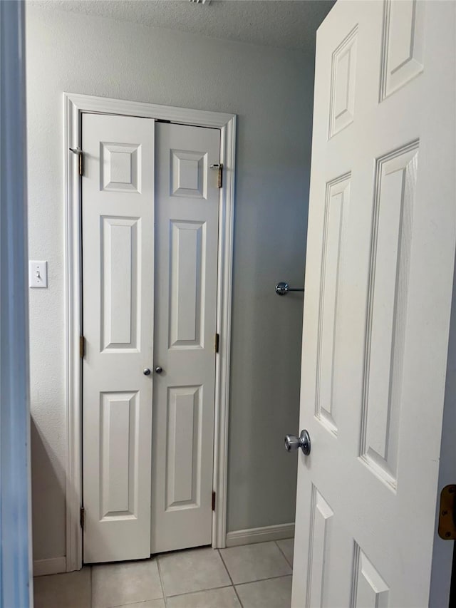 1140 Thomas Dr, Angleton, TX 77515 - bathroom featuring tile patterned floors and baseboards