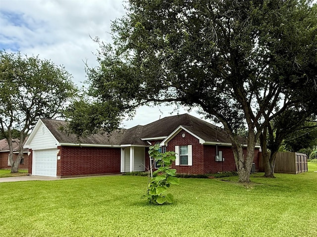 1140 Thomas Dr, Angleton, TX 77515 - single story home featuring a garage, brick siding, and concrete driveway
