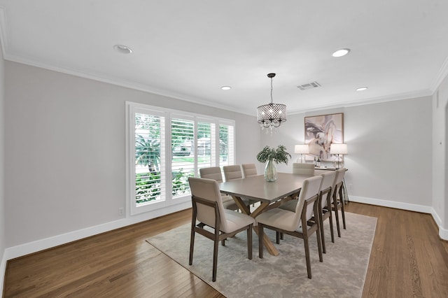 4310 Wigton Dr, Houston, TX 77096 - dining room featuring crown molding, a chandelier, dark wood-style flooring, and recessed lighting