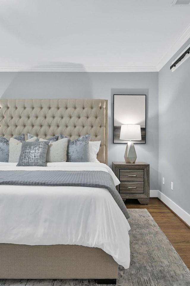 4310 Wigton Dr, Houston, TX 77096 - bedroom featuring wood finished floors and ornamental molding