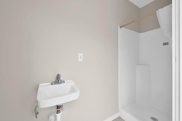 4310 Wigton Dr, Houston, TX 77096 - bathroom with a shower and baseboards