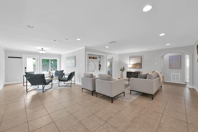 4310 Wigton Dr, Houston, TX 77096 - living room featuring arched walkways, ornamental molding, light tile patterned floors, and recessed lighting