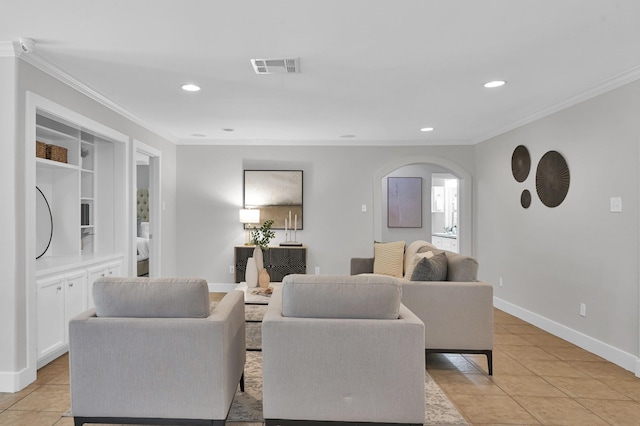 4310 Wigton Dr, Houston, TX 77096 - living area with arched walkways, crown molding, light tile patterned flooring, recessed lighting, and built in shelves