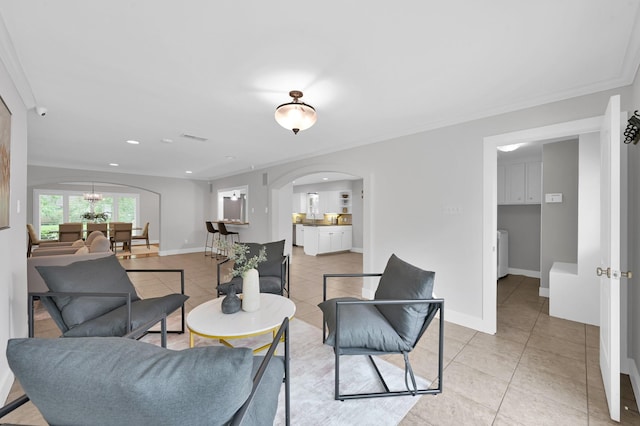 4310 Wigton Dr, Houston, TX 77096 - living room with arched walkways, light tile patterned floors, recessed lighting, and crown molding