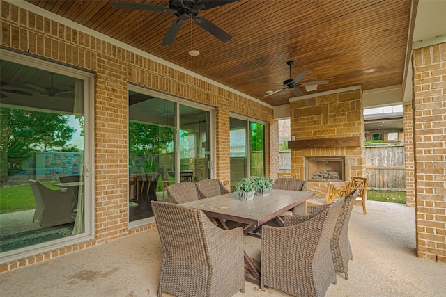 2418 Sandhill Crest Ln, Brookshire, TX 77423 - view of patio / terrace with an outdoor stone fireplace, ceiling fan, and outdoor dining space
