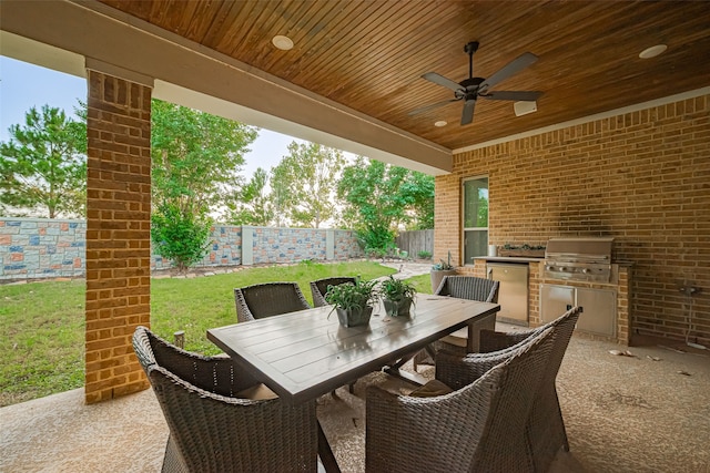 2418 Sandhill Crest Ln, Brookshire, TX 77423 - fenced backyard featuring exterior kitchen, ceiling fan, outdoor dining area, and a patio area