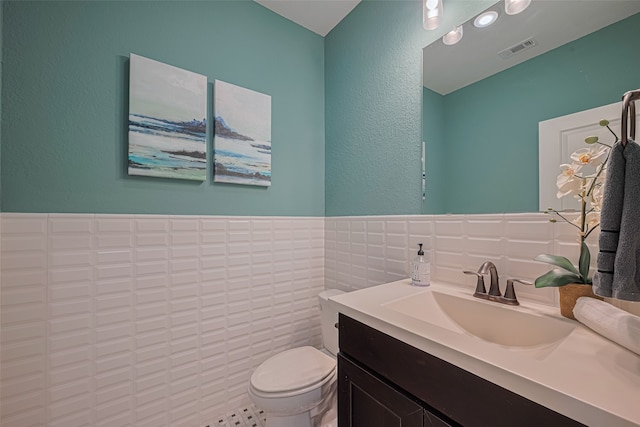 2418 Sandhill Crest Ln, Brookshire, TX 77423 - half bath featuring vanity, tile walls, and a textured wall