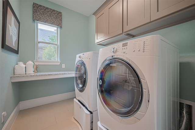 2418 Sandhill Crest Ln, Brookshire, TX 77423 - laundry room with washing machine and dryer, cabinet space, and light tile patterned floors
