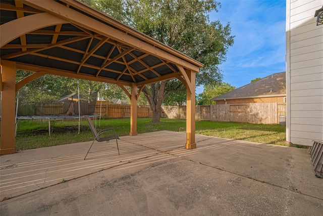10210 Squirehill Ct, Houston, TX 77070 - fenced backyard with a trampoline, a patio area, and a gazebo