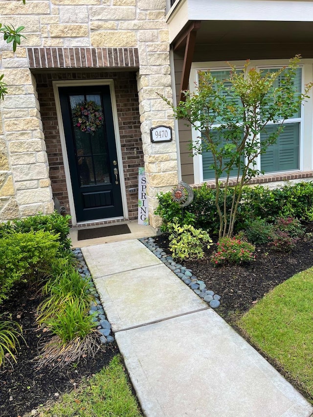 9470 Caddo Ridge Ln, Cypress, TX 77433 - property entrance featuring stone siding and brick siding